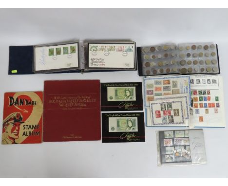 A quantity of stamps, forty first day covers & albums including foreign coinage twinned with Dan Dare stamp album, empty & tw