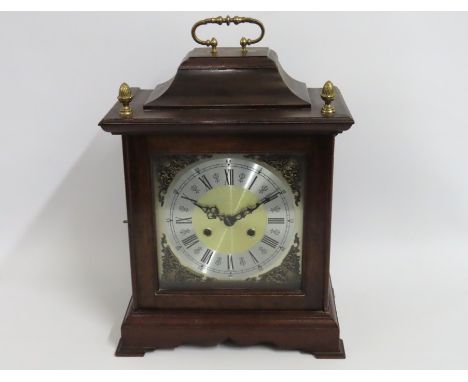 A bracket style clock with brass & silver coloured dial, 420mm high x 295mm wide x 180mm deep
