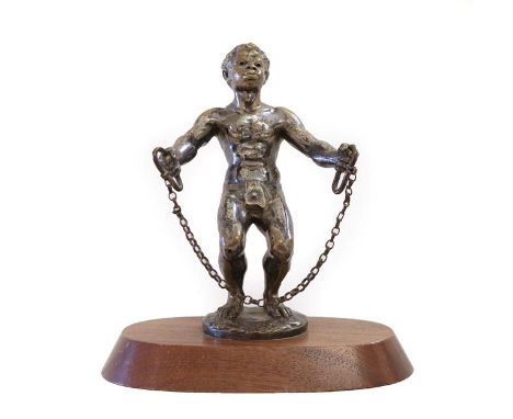 A Rare Nickel Plated on Brass Car Mascot, as a slave, the muscular male with arms outstretched holding rings and a chain, the