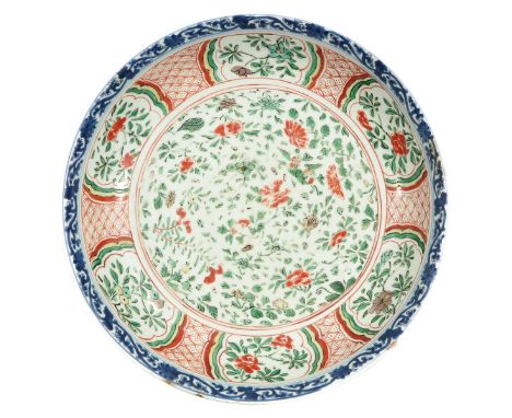 Decorated with flowers, Kangxi Mark and Period, 33 cm. in diameter, chip and hairline.