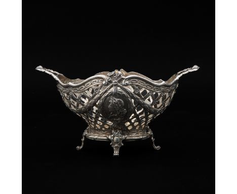 Decorated with portrait medallions and garland, 21 cm. long.