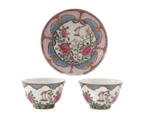 Famille Rose floral decor with hand holding sword, saucers are 13 cm. in diameter, cups are 8 cm. in diameter.