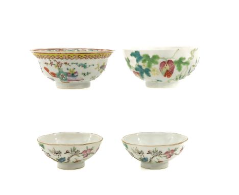Including 2 bowls and 2 cups in Famille Rose decor, largest cup is marked Qianlong and 12 cm. in diameter, hairline