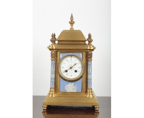 A GILT METAL AND JASPERWARE MOUNTED MANTEL CLOCK BY HOWELL, JAMES &amp; CO. the two train movement striking on a bell, the di