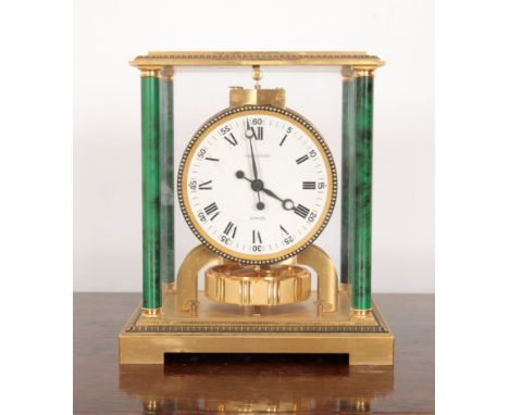A JAEGER-LECOULTRE BRASS CASED ATMOS CLOCK the white circular dial with Roman and Arabic numerals, contained in case with fau