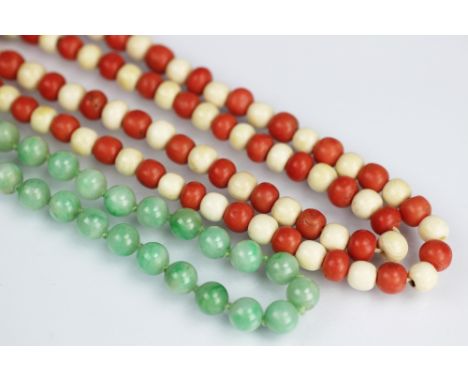 A jade coloured bead necklace, with later bolt ring clasp, length 43cm and a 1920's coral coloured and ivory bead necklace, 7