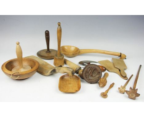 A collection of 19th century and later carved light wood kitchen utensils and accessories, to include a large ladle 42cm, a p