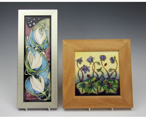 A Moorcroft tile or panel, circa 2010, decorated in a snowdrop deisgn by Vicky Lovatt, numbered 10/250, 30cm x 9.5cm, framed 