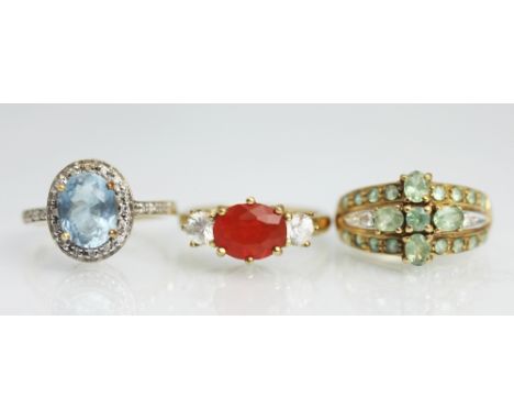 Three 9ct yellow gold gem set rings, set with an Aquamarine (1.75ct), Mexican fire opal and Alexandrite, all set in yellow go