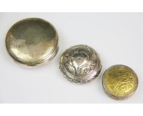 A silver circular snuff box, of plain polished form and with sprung lid, marks indistinct, 7.5cm diameter, weight 85.8gms, al