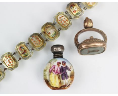 A bloodstone set seal, engraved with a dalmation crest and yellow metal mount, along with a mother of pearl bracelet and a mi