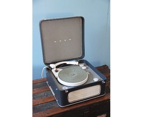 A vintage Bush record player, model SRP30L, number 444/07611, with a pair of binoculars and a sight (3)