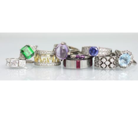 Nine assorted gem set rings, to include; cabochon amethyst coloured and further coloured stone set examples, all set in white