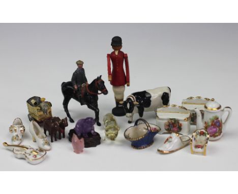 A collection of miniatures, to include; a Royal Worcester basket 2.5cm high, a Chinese quartz carved seated dog on stand 3cm 