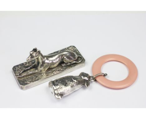 A Victorian silver plated model of a recumbent greyhound, Elkington and Co, on canted base, 9.25cm, with a silver plated baby