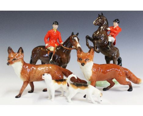 A Beswick model of a Huntsman, with a Beswick model of a rearing huntsman 868, with two beagles and two model foxes (7) 