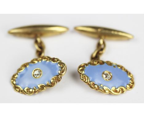 A pair of diamond set and enamelled cufflinks, each designed as an oval panel in lavender enamel and set to the centre with a