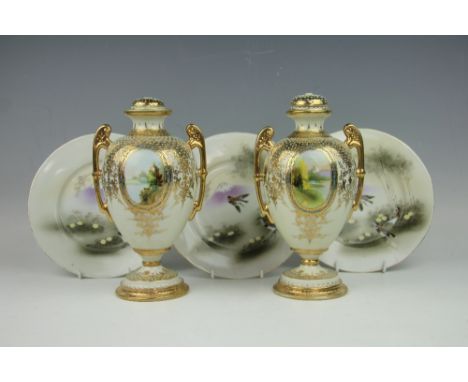 A pair of Japanese Noritake vases and covers, each twin handled urn shaped vase finely decorated with four vignettes depictin