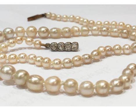 A single strand graduated natural pearl necklace, the eighty nine pearls graduating from 3.1mm to 6mm diameter, with attached