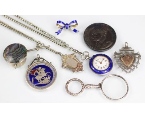 A Victorian ladies enamelled silver fob watch, the white enamel face with black Roman numerals and decorative gilt hands, wit