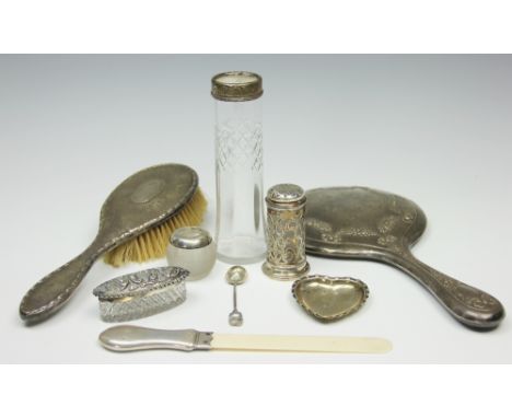 A selection of silver items comprising; a silver mounted and ivory page turner, Birmingham 1904, 22.5cm long, a heart shaped 