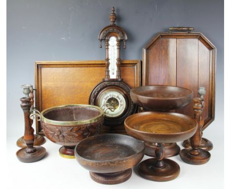 A Victorian brass mounted carved oak twin handled pedestal bowl, decorated with acorns, 31cm diameter, with four other turned