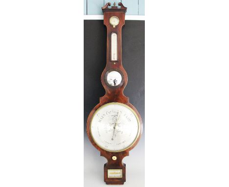 A Regency line inlaid mahogany wheel barometer, with engraved silvered dial above a spirit level signed 'W. Martinellli 2 Kin