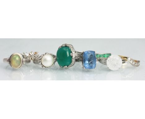 Eight gem set rings, each within silver settings stamped '925', to include jelly opal, emerald, moissanite and other stones, 