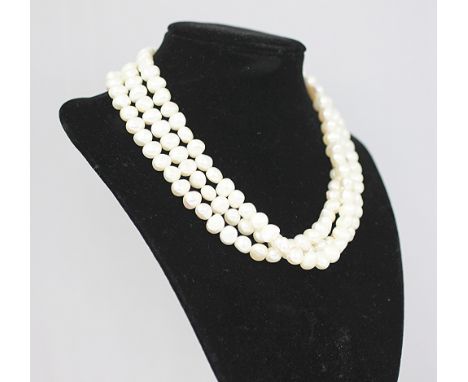 A three strand freshwater pearl necklace, with attached silver bead clasp, 41cm long