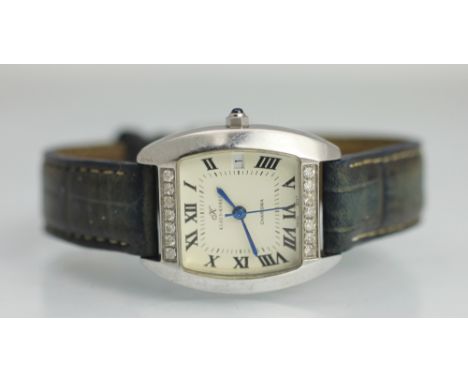 A Klaus Kobec diamond set ladies wristwatch, the cushion shaped dial set with two rows of diamonds, enclosing a cream dial wi