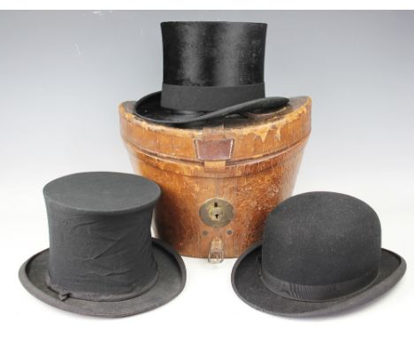 A gentlemans top hat within fitted leather hat box, engraved to handle 'R Chamberlain, Chislehurst', 26.5cm high, a 'Selfridg