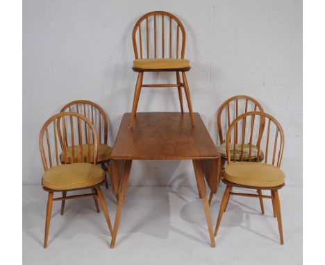 An Ercol drop-leaf dining table, with a matched set of five stick-back dining chairs