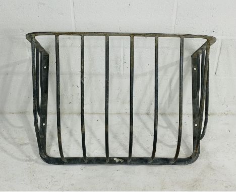 A vintage cast iron hay rack