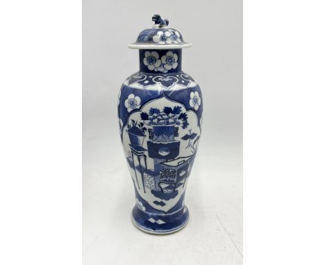 An antique Chinese lidded blue and white vase with foo dog finial and character mark to base - 29cm high
