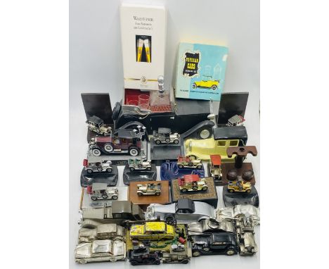 A collection of novelty items relating to Rolls Royce cars including money boxes, lighters, ashtrays, bookends, cigar pipe ho