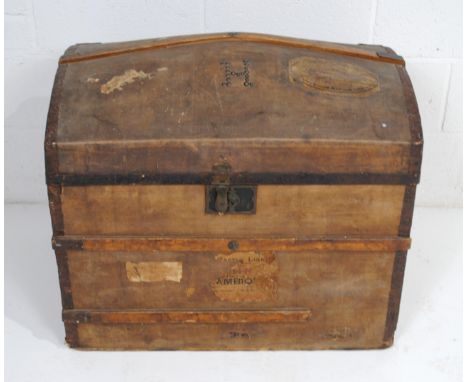 An antique metal-bound dome-topped wooden trunk, with studded 'H' to top and wrought iron handles