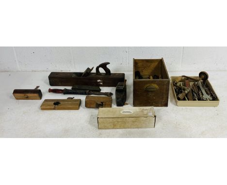 A collection of vintage tools including planes, pliers, chisels, drill bits etc