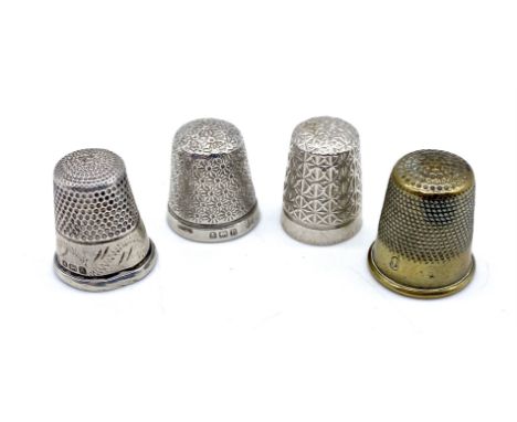 A Charles Horner silver thimble, two other silver thimbles and another.