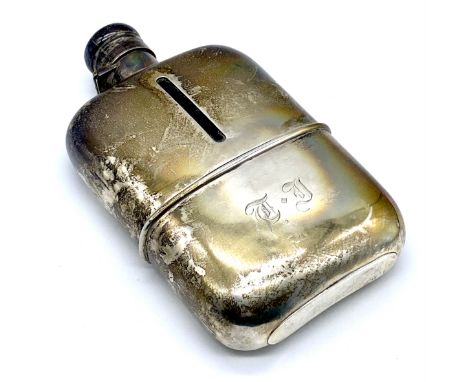 A hallmarked silver hip flask with glass liner- liner cracked