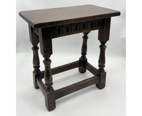 A vintage oak joint stool with repeated carved decoration 