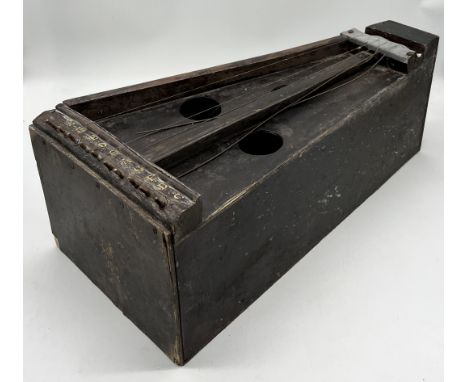 A vintage string instrument, likely a zither with resonator box below - in need of repair
