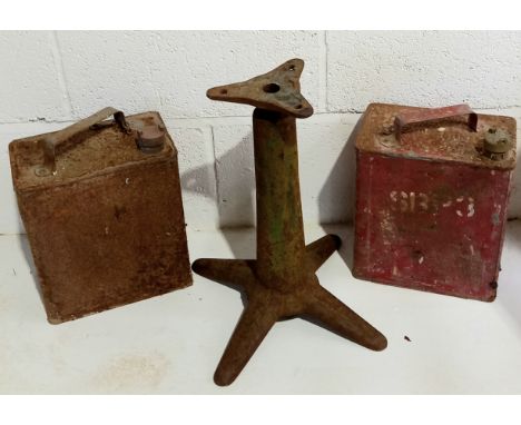 Two vintage petrol cans and a cast iron singer sewing stool base.