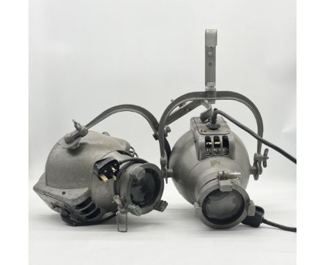 A pair of vintage theatre spotlights marked 'Strand Electric' 
