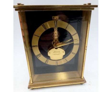 A Kaiser brass cased 7 jewel 8 day carriage clock with Perspex front and back and floating skeleton mechanism, 14cm. Running
