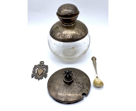 A small collection of silver items comprising of an antique silver topped glass scent bottle, silver lid with crown finial, s