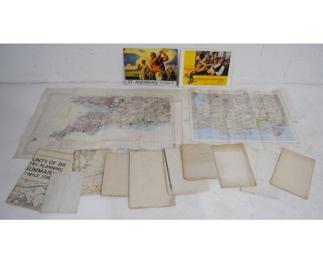 A collection of military edition maps, along with a James Bond poster, enamel sign etc.