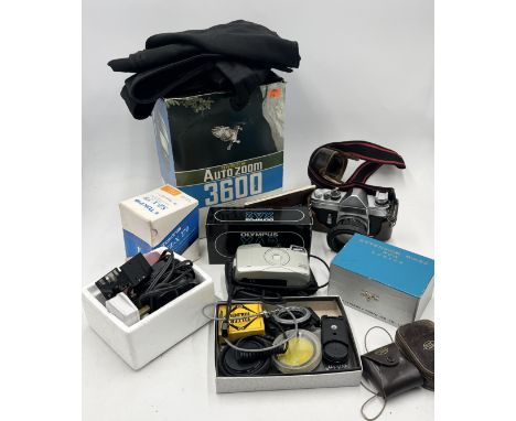A collection of cameras and accessories including Konica FP and boxed extension rings, Olympus XA2 in orginal packaging, Thyr