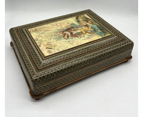 A Persian Khatam style Quran box raised on four feet with inner baize lining