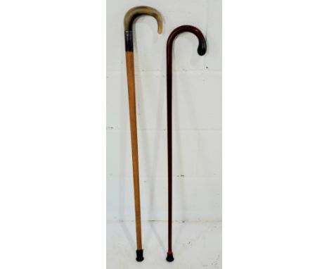 A silver mounted (London 1924) walking stick along with a horn handled with walking stick with silver mount