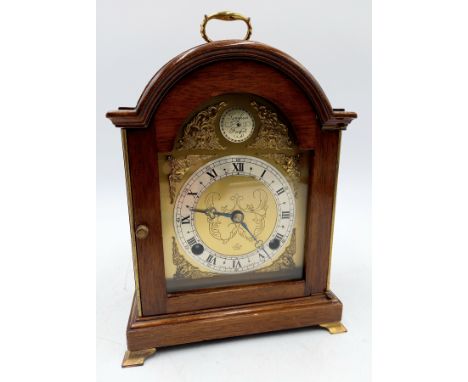 A Vintage mahogany cased bracket clock on brass bracket feet, 18cm wide 23cm high, retailed by George Pragnell Ltd.